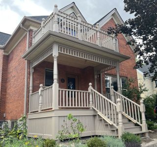 Our beautiful newel posts, shown on this amazing porch's first and second floors, complement our porch post pattern.