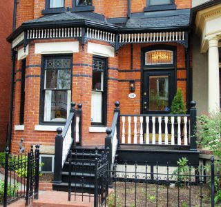 Newel posts with just a turned ball top give this house a modern look. Spindles and Spandrels were made by us also.